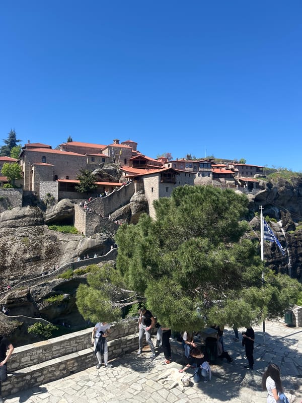 Tourists photograph themselves at Meteora monastery complex in Greece