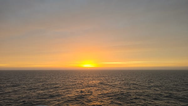 Ocean sunset captured with orange-yellow sky gradients