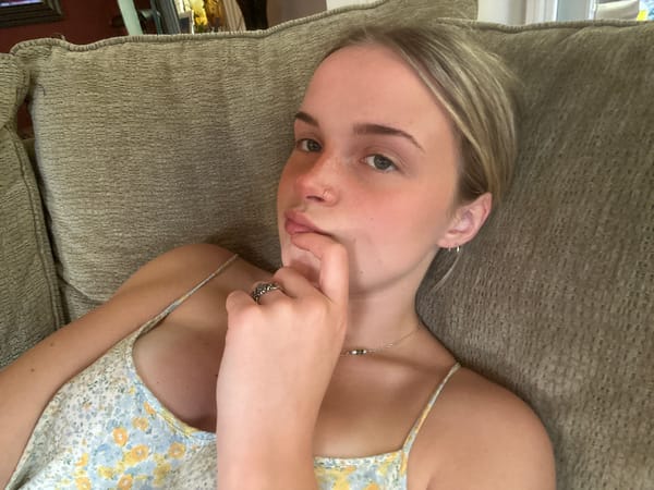 Young person photographed on couch in Whistler residence