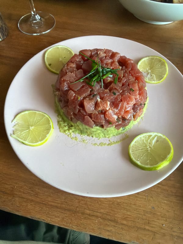 Diner enjoys tuna tartare meal at candlelit London restaurant