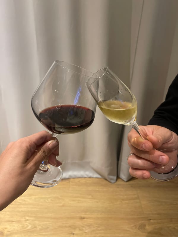 Afternoon wine gathering observed in city setting with flowers