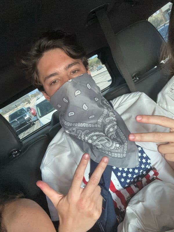 Masked Individual, Cowboy Boots Observed in Desert Area