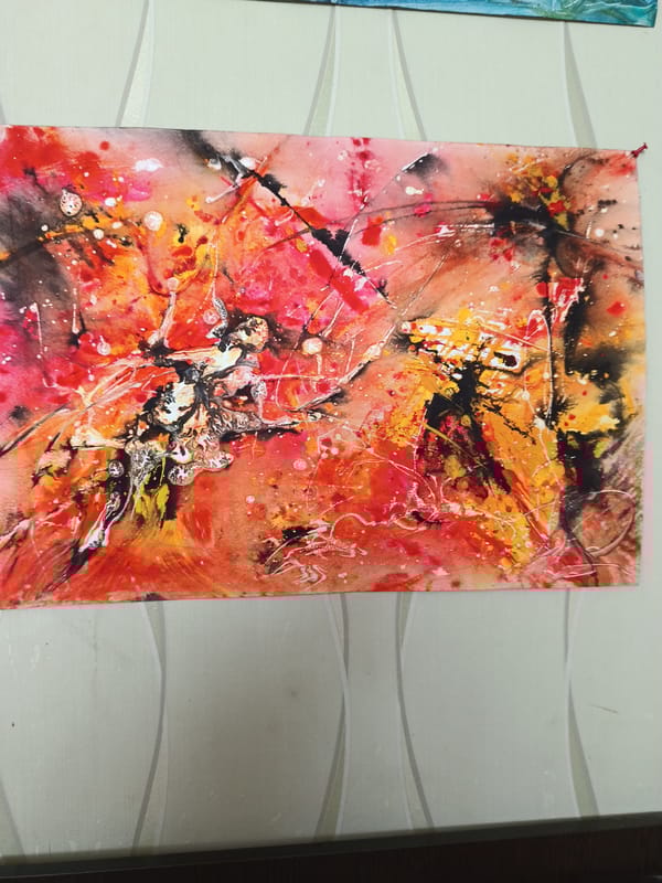 Abstract artwork displayed on patterned wall in Moscow