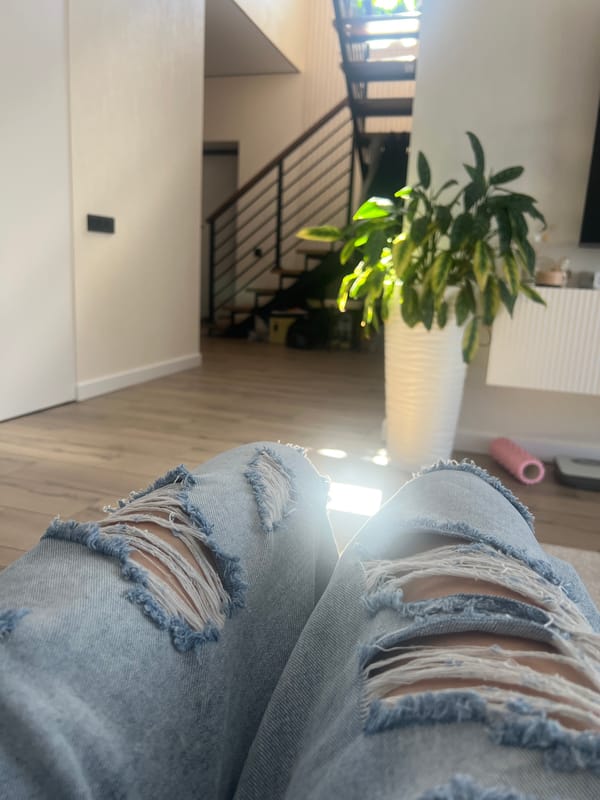 Ripped denim detail shots in a sunlit Votkinsk home