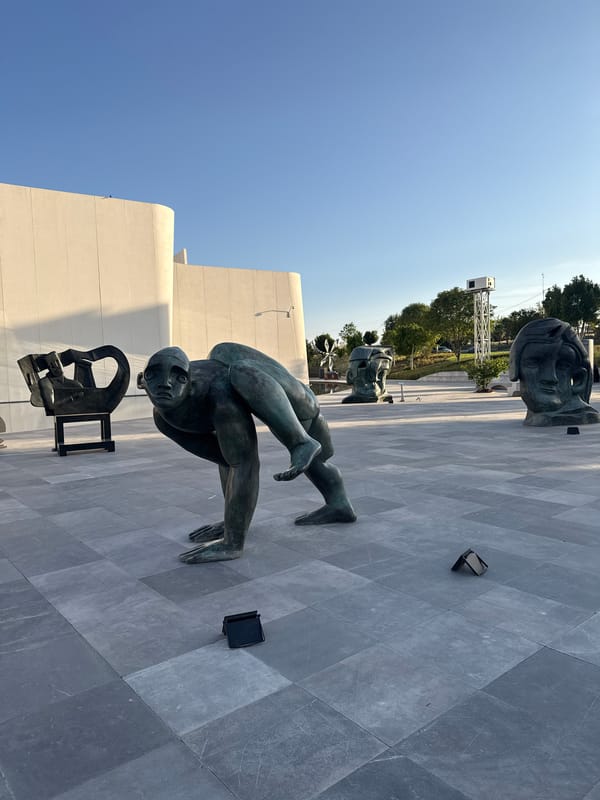 Modern architecture and sculptures observed in Mexican plaza