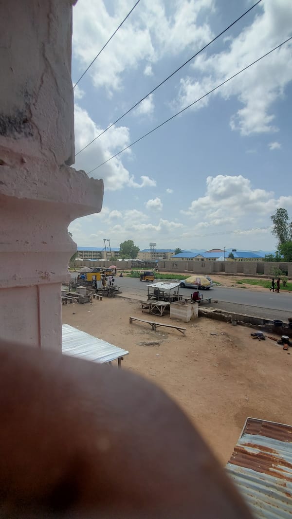 Street life along a busy roadside in a small African town
