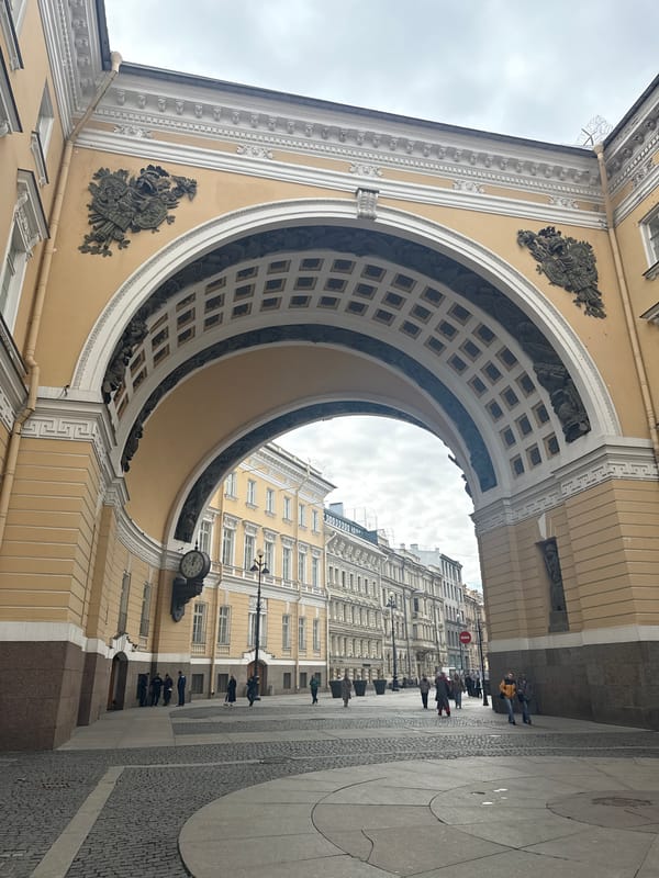 Witness captures grand cream-colored archway from street level