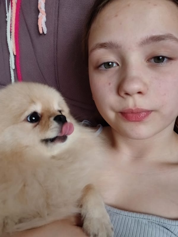 Woman and Pomeranian dog captured in casual moments, Krasnodar
