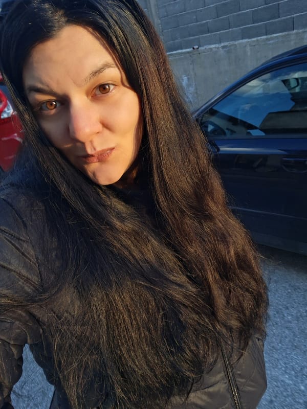 Woman observed on sunset street in Goce Delcev, Bulgaria