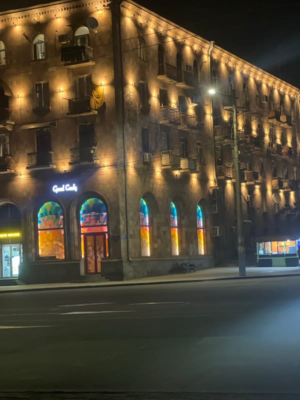 Evening scenes captured in Yerevan showing illuminated buildings, traffic