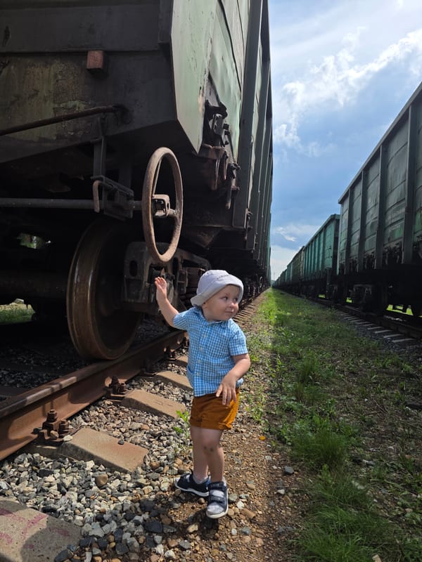 Toddler explores a freight rail yard in Chaikovsky, Russia