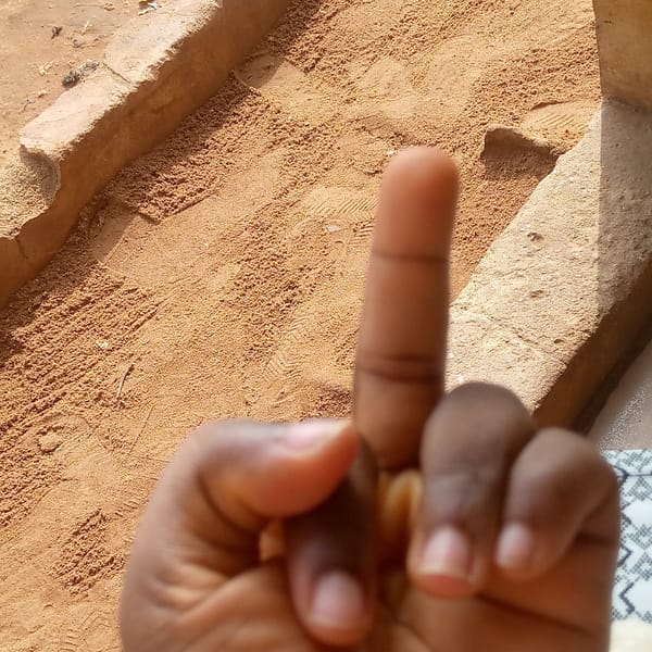 Person makes obscene gesture in Nsugbe, Nigeria