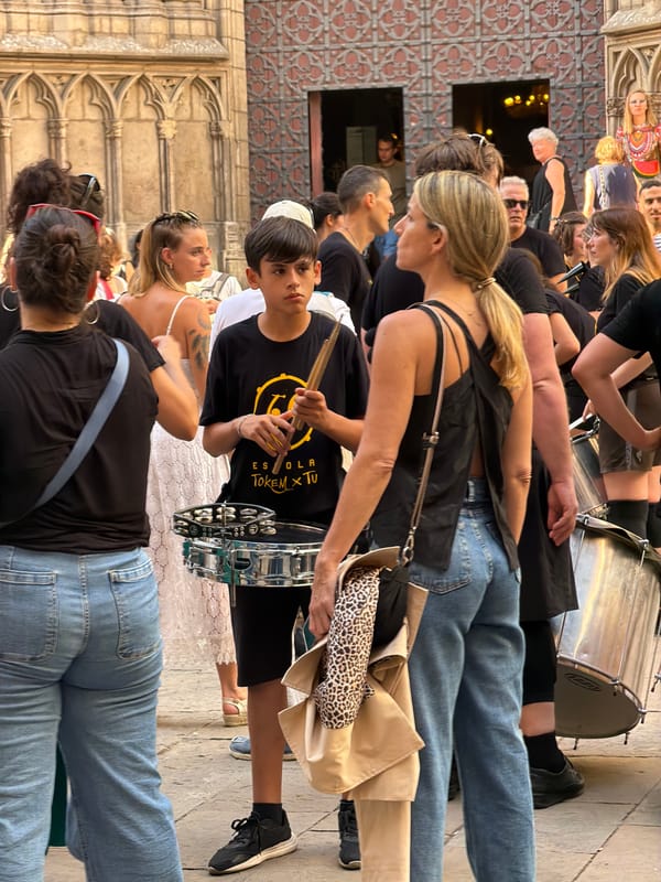 Drumming group performs through Barcelona's Gothic Quarter streets