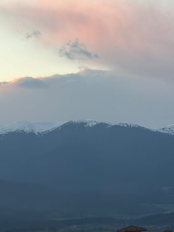 Twilight sky captured over snow-capped mountains in Bansko, Bulgaria
