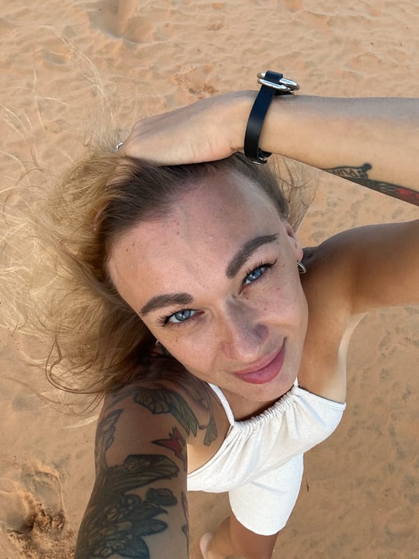 Woman poses for photos at Mũi Né sand dunes