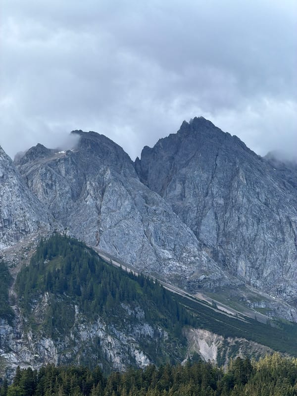 Zugspitze massif looms under cloudy skies near Grainau
