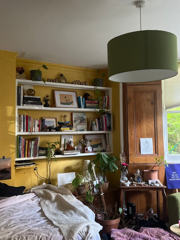 Inside a characterful London home, yellow walls and quirky art