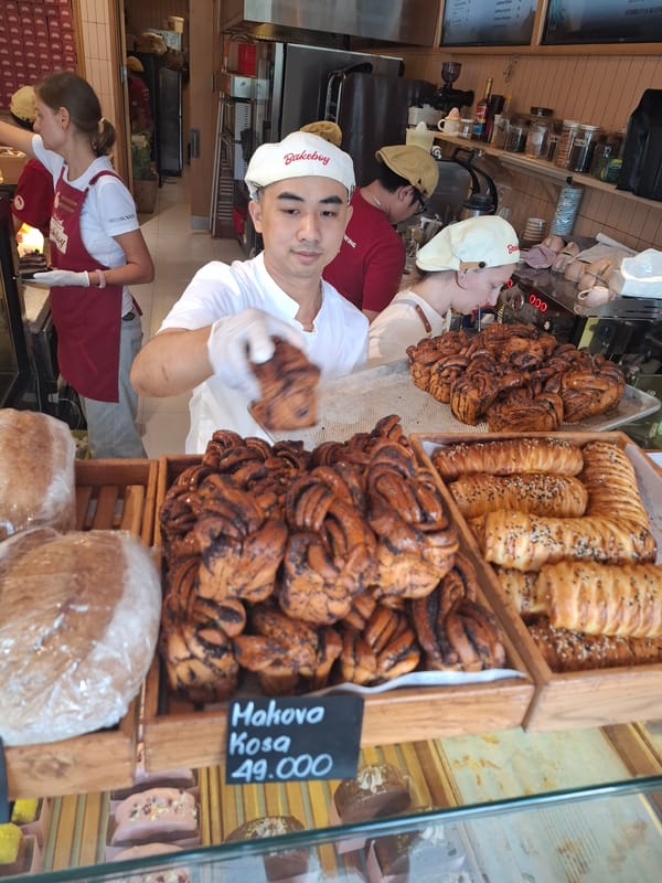 Bakery pastries and street fruit at a Nha Trang morning market