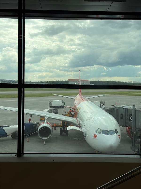 Mother and baby travel through Moscow's Sheremetyevo Airport