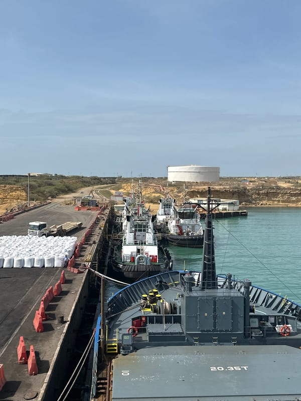 Cargo ship with bulk containers documented at Uribia port