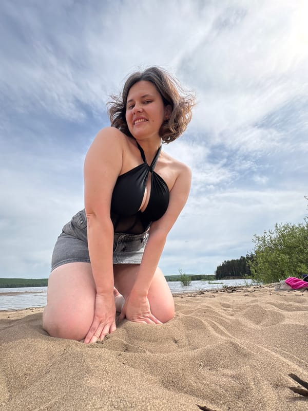 Woman photographed on beach in Chaikovsky, Russia morning scene
