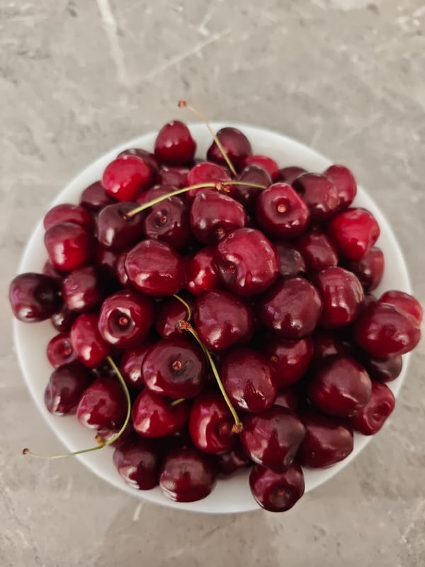 Cherries and flowers in a Tiraspol kitchen, June morning