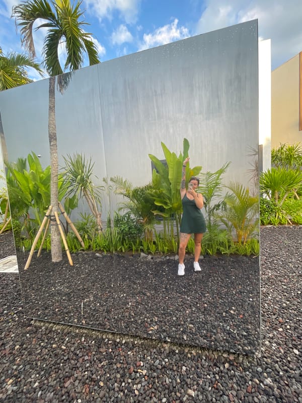Mirror selfies at a reflective cube installation in Kediri