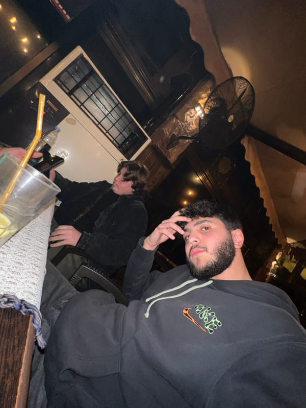 Young men socialize at Damascus cafe during evening hours