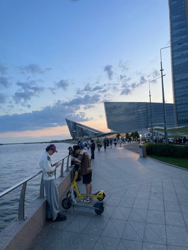 Evening gatherings documented along urban waterfront promenade during golden hour