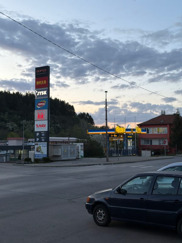 Retail park signage captured in Dupnitsa, Bulgaria street scene