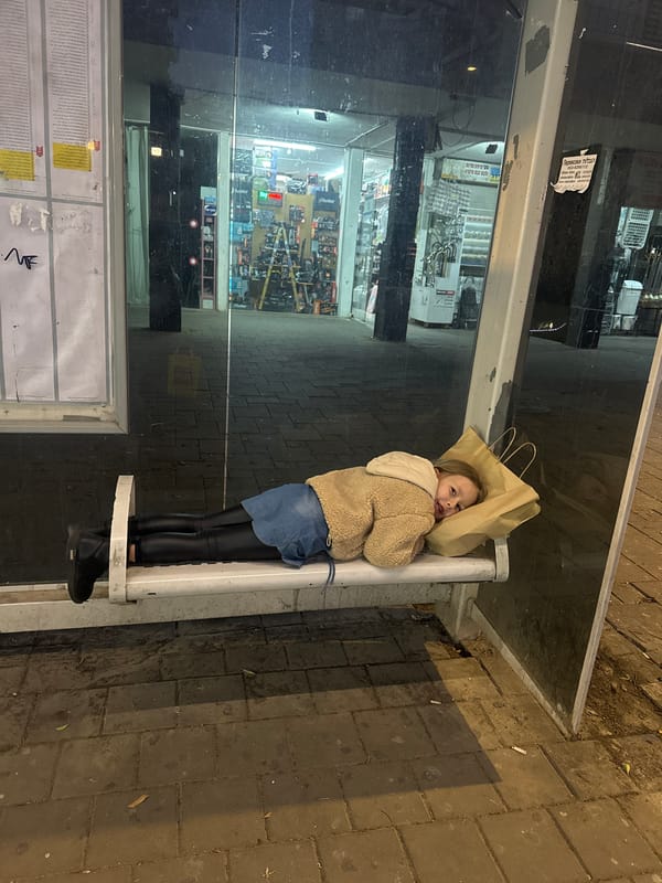 Girl with paper bag over head spotted at Bat Yam bus stop