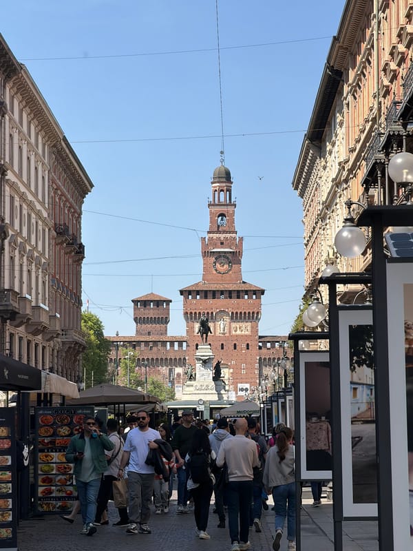 Pedestrians and vendors active near Milan's Sforza Castle