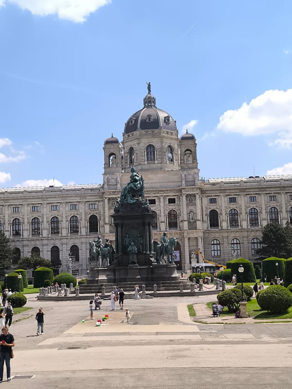 Tourist documents Vienna museum district tour on sunny morning