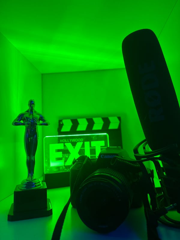 Film equipment setup captured in green-lit still life composition