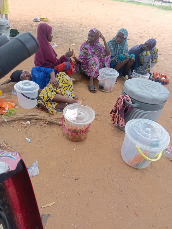 Women gather in outdoor area in Akwanga, Nigeria