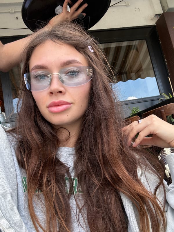 Woman observed at outdoor cafe, May 16 2026