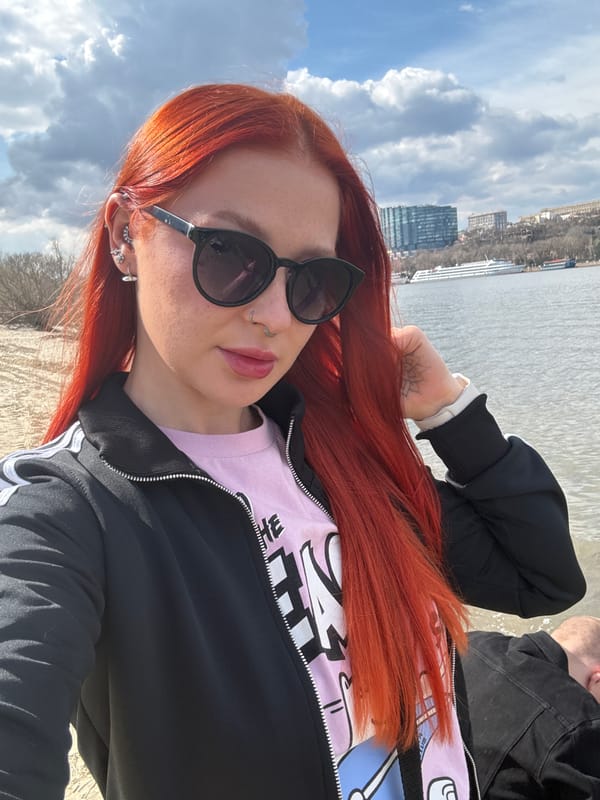 Woman documents riverside visit in Rostov-on-Don with selfies, scenery