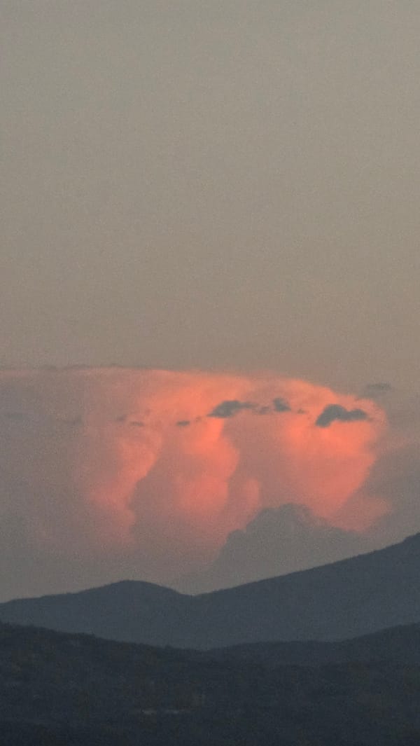 Balcony sunset over Blagoevgrad, clouds and beer included