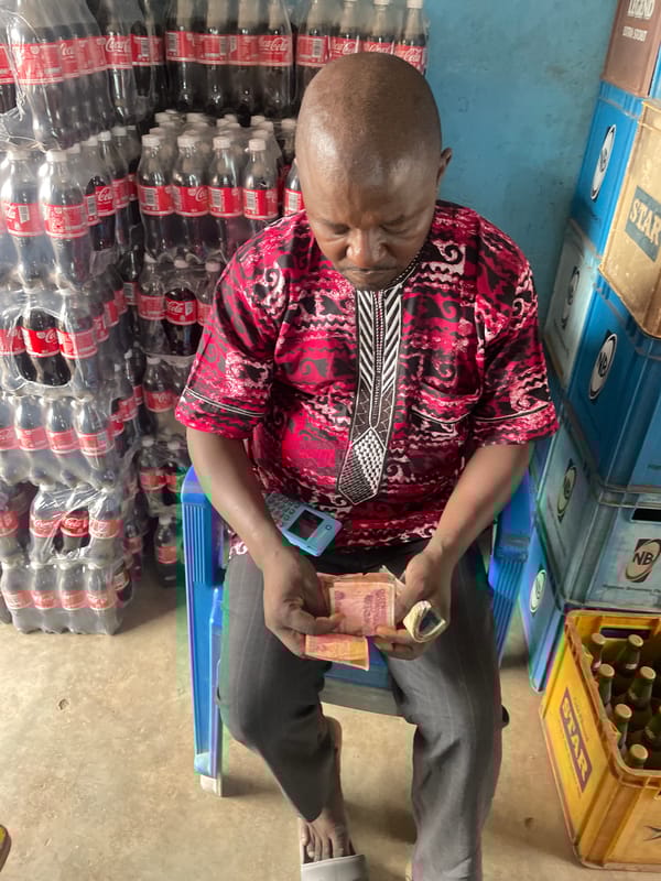 Social gathering with dancing and posing documented in Jos