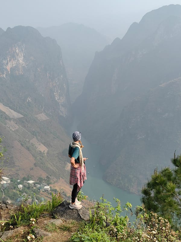 Tourist enjoys scenic mountain overlook in northern Vietnam
