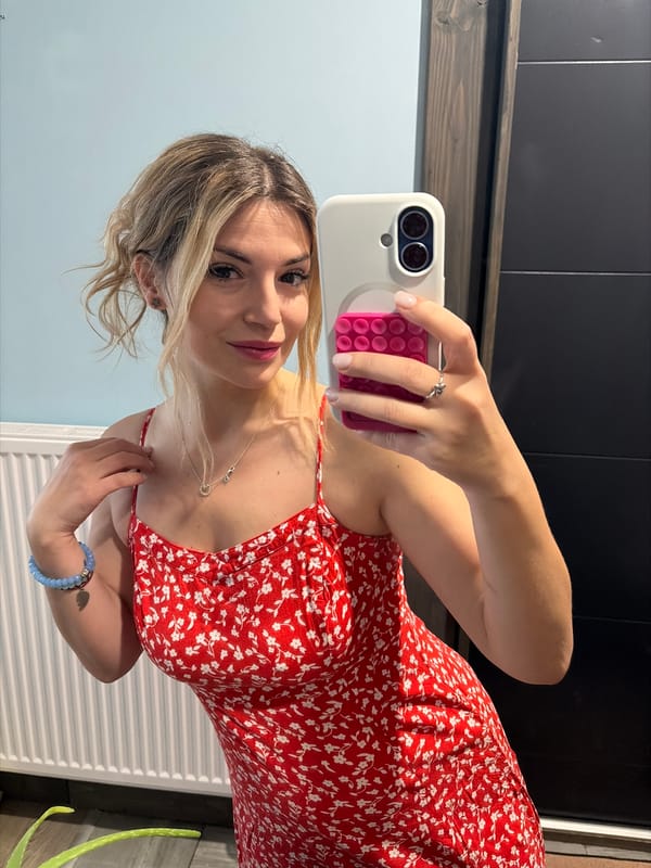 Woman takes selfie in red dress, Wisła Poland