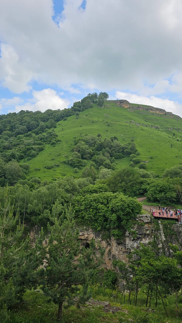 Glass bridge, waterfalls, and market snacks at Chegem Gorge