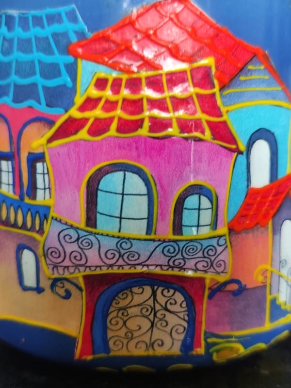 Artistic subjects documented: whimsical building drawing and rock figurine