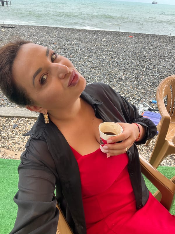 Afternoon at Sokhumi's pebble beach, grey skies and selfies