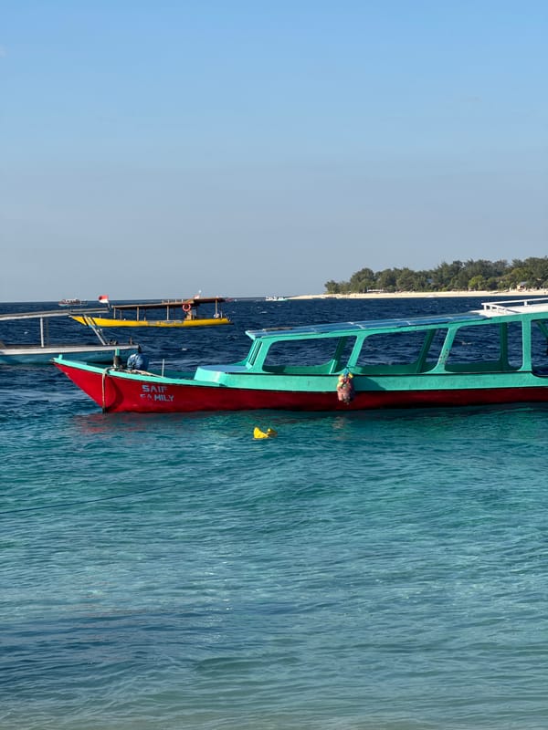 Boats, beach soccer, and turquoise water at the Gili Islands