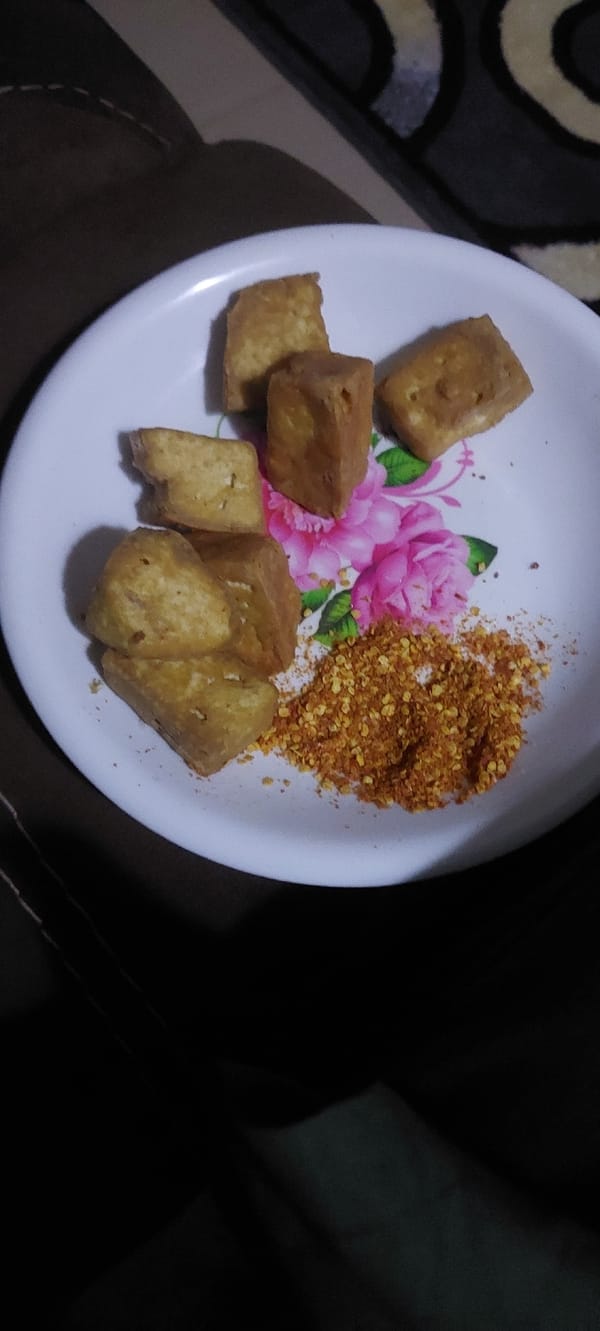 Fried tofu meal served at home with a side of ambiance
