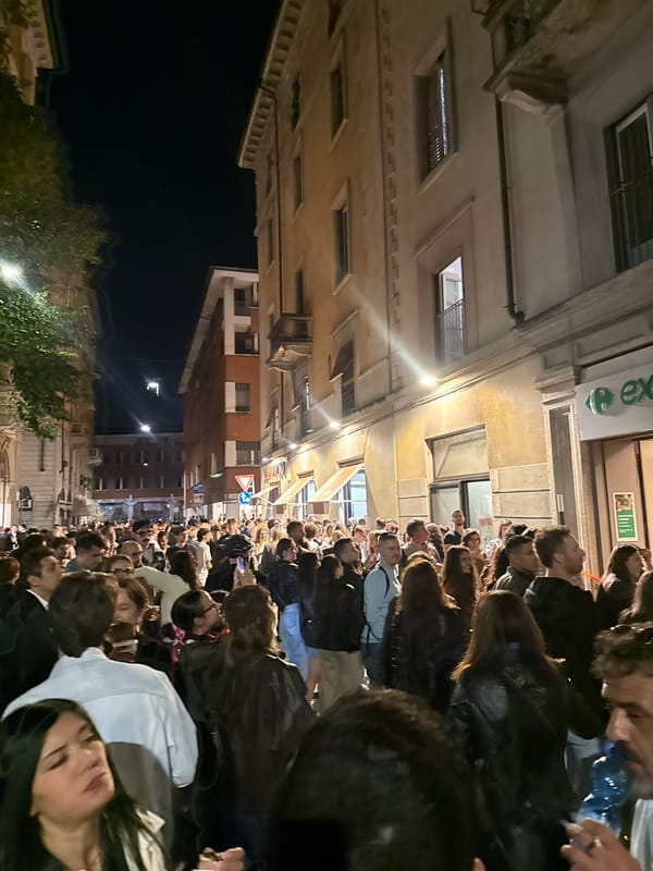 Large crowd gathers on Milan street Friday night