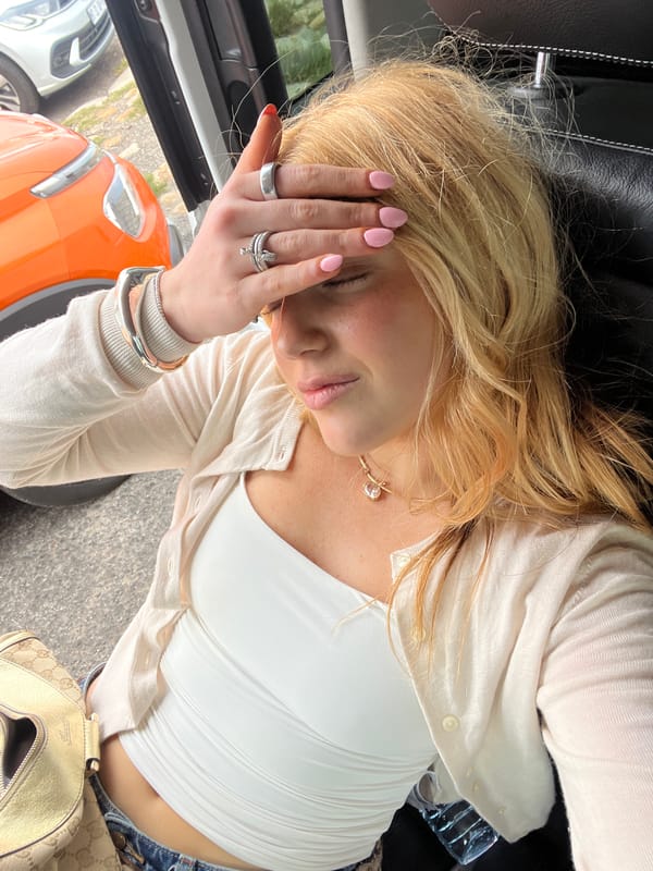 Woman observed resting in vehicle passenger seat in Cape Town