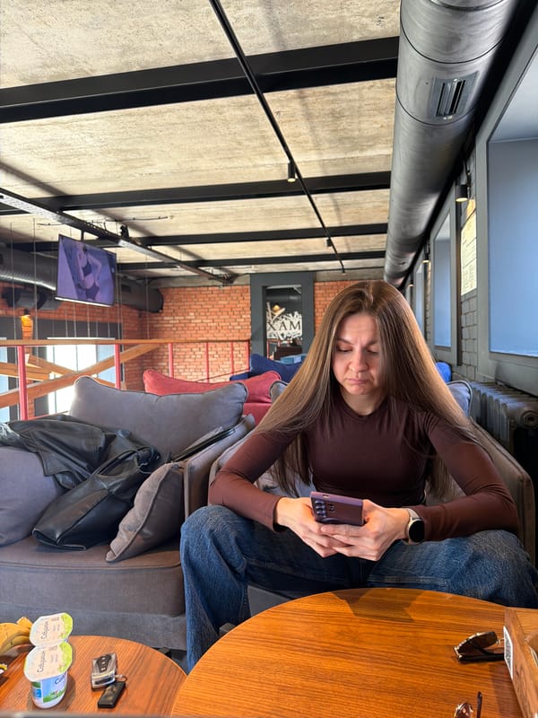 Woman uses device in industrial interior space in Kazan