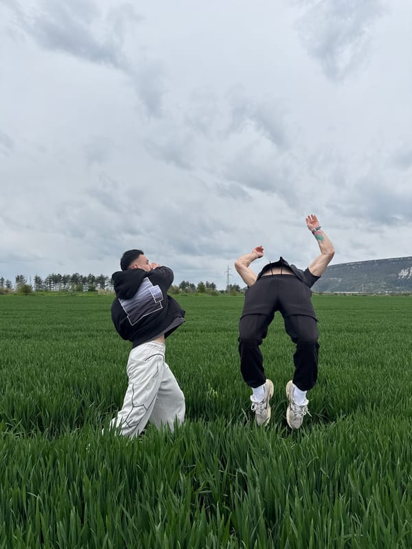 Two people pose in crop field in Shumen, Bulgaria